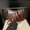 Bolso de hombro de moda 2025 para mujer, estilo coreano, sencillo, de color sólido, con textura de alta calidad y bandolera de nicho.