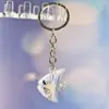 Nuevo Colgante Creativo de Bolsa con Cara Sonriente de Pulpo Brillante Dibujo Animado Pequeño Regalo Llavero de Moda Anillo de Llave