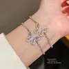 Pulseira ajustável estilo ins coreano com pingente de borboleta em zircônia, moderna e versátil para o uso diário, joia de luxo leve e com toque de alta qualidade