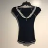 Top corto sexy y elegante con escote en V de encaje al por mayor 2026 camiseta de manga corta para mujer color azul marino de verano