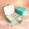 Caja de joyería portátil de stock de fábrica, caja de exhibición de accesorios de gran capacidad con espejo, caja de almacenamiento para aretes de oro, anillos y collares