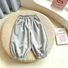 Nuevos estilos de primavera y otoño para exportación: Pantalones deportivos para niños, pantalones casuales y pantalones de chándal, adecuados tanto para niños como para niñas, de estilo coreano, diseñados para uso en exteriores