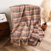 Chal largo de cachemira sintética Xinjiang Adelais para mujer, adecuado para primavera y otoño, chal versátil de jacquard de doble cara para aire acondicionado con borlas
