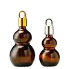 Botella gotero de punta de pegamento de calabaza doble marrón al por mayor Botella con roller para aceite esencial Botella cosmética Botella vacía reempaquetada para loción de esencia