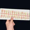 Uñas postizas de alta gama hechas a mano para comercio exterior en rosa nude y blanco con diseños tallados y baño de oro, disponibles para venta al por mayor