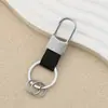 Llavero de Cuero Simple Personalizado Moda para Hombre Colgante de Cintura Llavero de Coche Almacenamiento en Casa Anti-pérdida Colgante con Hebilla en U