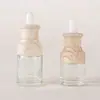 Novos Acessórios de Tampa de Ombro de Bambu Frasco Redondo de Vidro para Essência 20ml 30ml Frasco Conta-gotas para Skincare e Cuidados com os Cabelos Frasco de Óleo Essencial
