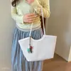 Bolsa de hombro tejida de gran capacidad para mujeres jóvenes, versátil para el uso diario, estilo coreano, verano, nueva bolsa de oficina 2026