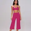 Conjunto de yoga transfronterizo para mujer, con un diseño de alta gama, sujetador deportivo absorbente de impactos, ajustado, de secado rápido, pantalones de yoga de cintura alta de longitud media.