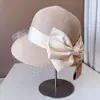Chapéu de pescador de malha francesa chapéu de palha de proteção solar de verão feminino estilo Hepburn Big Bow Chapéu de bacia chapéu de praia à beira-mar maré