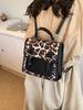 Popular transfronteriza este año bolsa de leopardo de color contrastante de nicho mochila para mujer 2024 nueva versátil bolsa de viaje