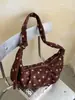 Bolso de lunares de nicho súper popular para mujer, nuevo bolso cruzado de moda 2026, exquisito bolso de hombro para axila, bolso de cuerno