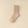 Calcetines de color sólido de comercio electrónico transfronterizo, venta al por mayor de invierno, calcetines altos de tubo gruesos y cálidos para mujer, calcetines de comercio exterior