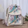 Mochila casual de doble uso tejida y bordada con jacquard de hilo de oro de estilo étnico, perfecta para viajar en Yunnan