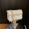 Bolso Tejido de Alta Gama Transfronterizo para Mujer 2025 Nuevo Verano Moda Borla Un Hombro Bolso Cuadrado Pequeño Versátil Bolso Bandolera