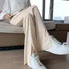 Calça feminina casual de verão em seda gelada, pantalona com fenda e cordão, cintura alta, modelagem que afina a silhueta, solta, versátil, que alonga a estatura, comprimento até o chão