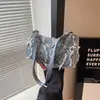 Bolso de Mujer de Alta Gama Transfronterizo Diseño de Nicho Bolso de Hombro con Borlas para Mujer Nuevo 2024 Bolso Mini tipo Bagel