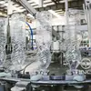 Proveedores de Fabricantes de Guangdong Máquina de Llenado de Agua Mineral Tres en Uno 3000 Botellas Máquina Automática de Llenado de Agua Embotellada Líquido