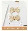 Ventas directas transfronterizas de tacones altos desmontables con flores de zapato de pedrería, hebillas de lazo brillantes y clips metálicos para zapatos.