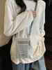 Bolsa de Celular Fashion com Recortes para Mulheres 2025 Nova Versátil Design de Nicho Bolsa Transversal Leve Casual para Compras Porta-Moedas