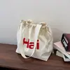 Versión Coreana Transfronteriza 2026 Primavera Nuevo Bolso Tote Casual de Gran Capacidad con Estampado de Letras Ligero Estilo Perezoso Bolso de Hombro