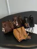 Este año, los bolsos tipo cubo de estampado de leopardo de moda son tendencia en el mercado de exportación.. Aquí está la nueva colección 2026: un bolso de hombro y bandolera retro y versátil para mujer