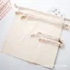 Suministro de fábrica esta bolsa de algodón blanca con cordón bolsa de almacenamiento bolsa de maquillaje para estudiantes