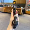 Llavero Colgante Símbolo Musical de Cuero PU Creativo Simple para Pareja Llavero de Coche Bolsa Accesorio Pequeño Regalo