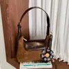 Bolso de viajero transfronterizo moderno y elegante para el otoño de 2026: Estilo coreano, diseño de nicho, retro y único, adecuado para uso casual y como bolso de hombro o cruzado