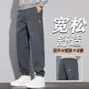 Pantalones casuales grises de otoño para hombre, corte holgado, con puño, pantalones de nueve puntos, marca de moda nueva 2026, pantalones deportivos tipo harén con retazos