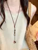 Nuevo collar largo degradado de estilo chino para mujer, lujo ligero vintage con un toque de alta gama, cadena para suéter de estilo étnico, accesorio de diseño nicho