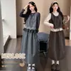 Novas roupas de maternidade para outono e inverno: um vestido colete de bolinhas para usar por cima, combinado com um conjunto de duas peças com detalhes em renda e design de amarrar para cobrir e dar suporte à barriga