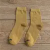 Otoño e invierno nuevos calcetines para hombre y mujer Tubo clásico para jalar Amantes Joker color sólido algodón calcetines para hombre al por mayor