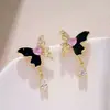 Pendientes de mariposa asimétricos con diseño único y sentido del nicho, pendientes colgantes de gota de agua súper brillantes de lujo y de alta gama, nuevos pendientes