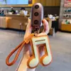 Llavero Colgante Símbolo Musical de Cuero PU Creativo Simple para Pareja Llavero de Coche Bolsa Accesorio Pequeño Regalo