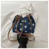 Comércio exterior artístico e moderno bolinhas moda 2026 novo tecido Oxford estiloso e requintado cordão transversal bolsa de ombro tipo balde