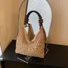 Bolsa de Palha Trançada de Grande Capacidade para Comércio Exterior para Mulheres Verão 2025 Novo Design de Nicho Bolsa de Ombro para Férias na Praia