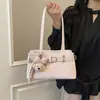 Bolsa de Niña Conejo 2026 Nueva Moda Casual Texturizada Simple Moderna Nicho Versátil para Viajes Diarios Bolso de Hombro