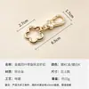 Anillo de resorte de flor de ciruelo más vendido transfronterizo, cierre de langosta de metal, cierre giratorio de flor de aleación para manualidades, accesorios de ferretería