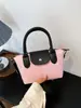 Bolso de hombro de nailon simple color block, bolso con forma de dumpling, versátil para primavera y verano, un bolso de mano de nicho y elegante con una textura de moda