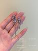 Aretes asimétricos de borla de mariposa de cristal, aretes populares de celebridad en línea 2023, diseño elegante de nicho, aretes de alta gama