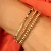 Pulsera Cruzada Europea y Americana de Perlas Doradas Nueva Pulsera de Perlas Redondas con Electrochapado de Cobre 14K Pulsera Elástica de Perlas Hecha a Mano Venta al por Mayor