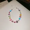 [Cadena de Diamantes Arcoíris] Pulsera de extracción de zircón trenzado en cruz, una pulsera lujosa y de alta gama, una pieza de joyería delicada y de moda