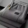 Pantalones deportivos para hombre al por mayor transfronterizos, nuevo modelo primavera y otoño 2026, pierna recta, corte holgado, gris, pantalones casuales de negocios de alta gama para hombre