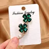 Nuevo broche de trébol de cuatro hojas antideslizante para mujer, corsage de alta gama y exquisito, pasador antideslizante, accesorio para suéter