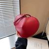 Bolso de diseño de nicho de moda para mujer, nuevo estilo 2024, popular bolso bandolera combinable, mini bolso en forma de corazón, bolso de color liso para debajo del brazo.