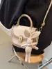 Bolso bandolera pequeño con textura de moda para mujer, primavera y verano 2024, nuevo bolso de hombro combinable, estilo occidental, bolso de sillín portátil