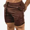 Cross-border Muscle Fitness Masculino Shorts Esportivos Malha Fina Quick-drying Casual Running Training Respirável Calças de praia respiráveis