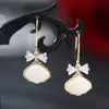Brincos de metal com concha estilo coreano joias geométricas simples brincos de menina S925 brincos de temperamento nicho pronta entrega