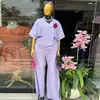 Ropa Femenina Transfronteriza Europea y Americana Moda Nueva Verano 2026 Camiseta de Manga Corta Rayada con Cuello en V Conjunto Casual de Pantalones Largos de Pierna Ancha